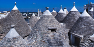Discover whitewashed trulli in Puglia