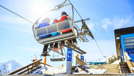 Family riding a ski lift