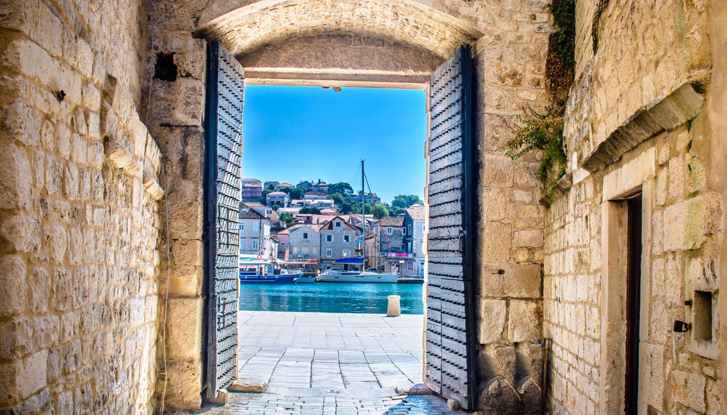 Top 5 places to enjoy the sun this summer - City gates in Trogir, Croatia