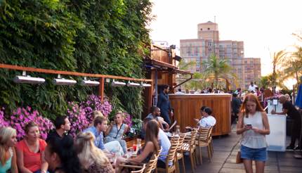 People relaxing at the 230 Fifth Rooftop, New York City