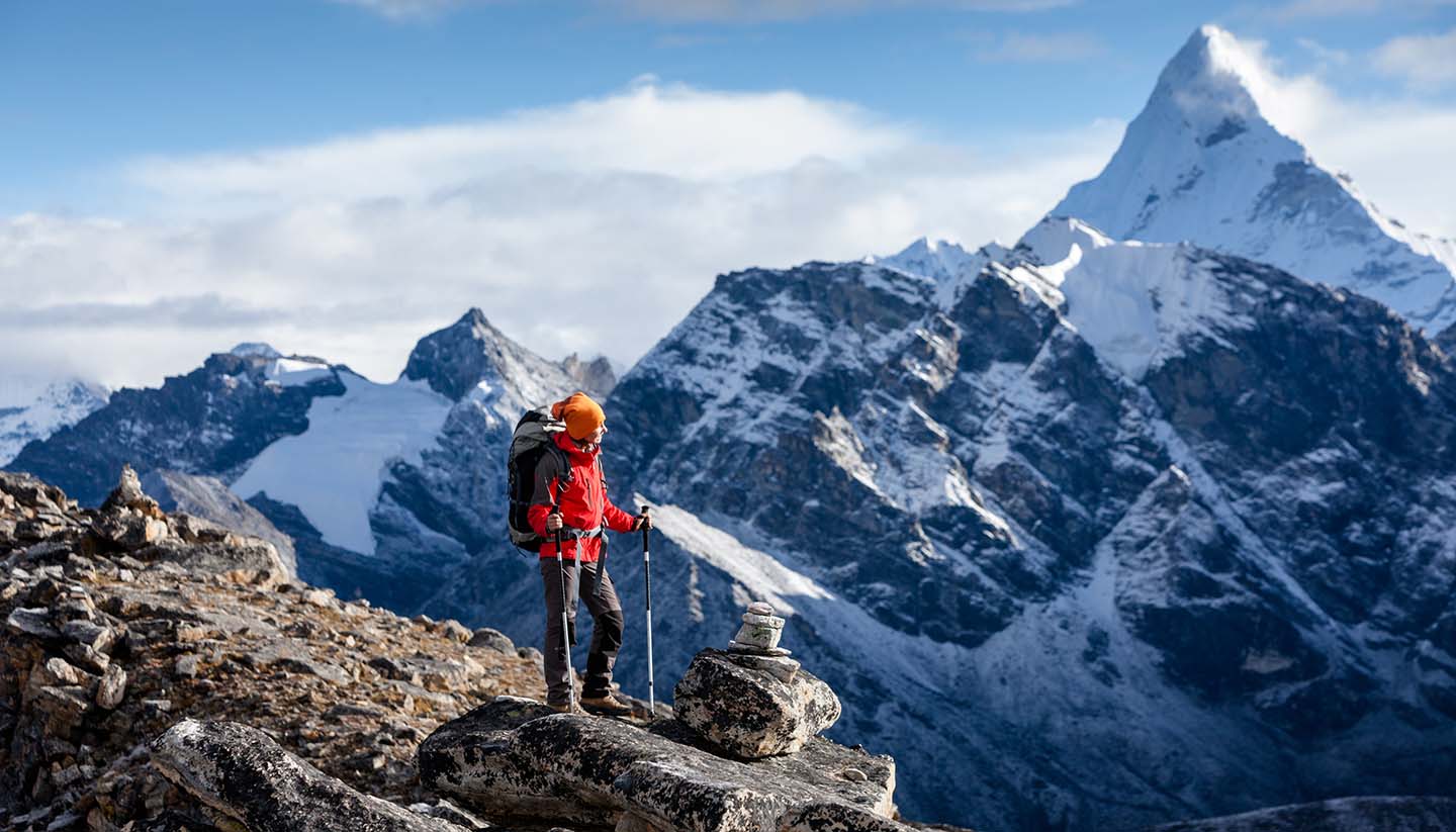 Trekking in Nepal - Hiker posing on trek in Himalayas, Nepal