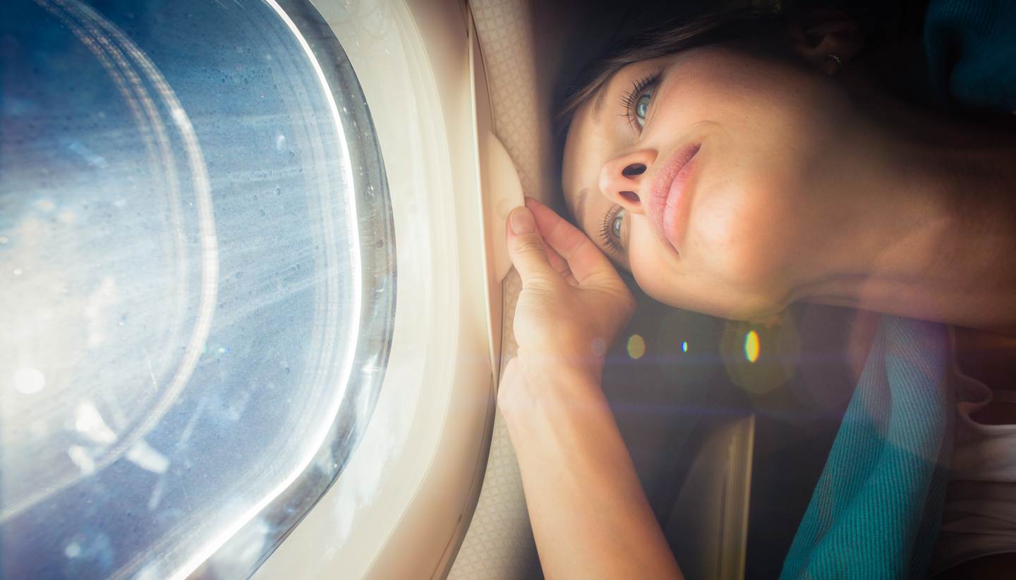 Five tips: beating boredom on a longhaul flight - shu-Travel-Plane-Woman-469234196-lightpoet copy