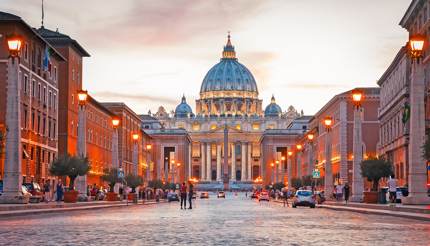 View of Illuminated Saint Peter`s Basilica and Street Via della Conciliazione