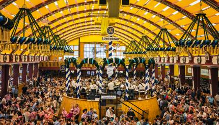 People drinking in the Lowenbrau Beer Tent