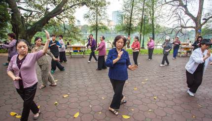 Seniors practicing Tai Chi by Hoan Kiem Lake