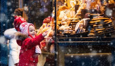 Child points at treats in the shop window