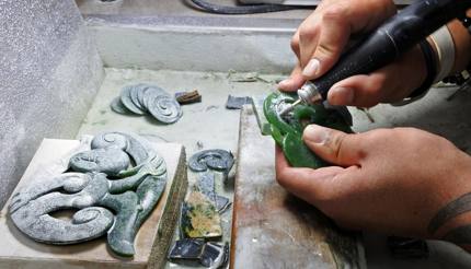 A craftman working on Pounamu (greenstone)