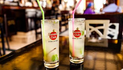Two glasses of Havana Club with mint leaves and a straw each