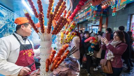 Vendor selling street snacks on Wangfujing Snack Street