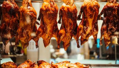 Roast duck hanging in shop window