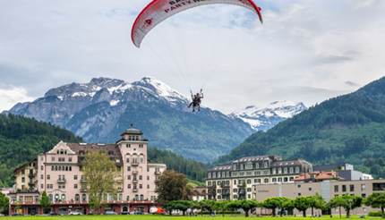 shu-Switzerland-Interlaken-Paragliding-over-Interlaken-716541055-editorial-430x246