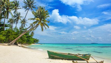 Boat on the beautiful tropical beach of Karimunjawa island, Indonesia