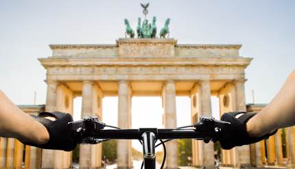 Closeup of bike handles in front of Brandenburg Gate, Berlin