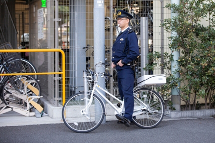 A Japanese police officer on a bicycle