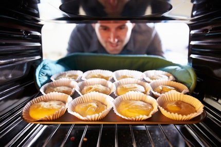 A man baking at home