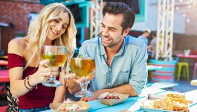 A couple enjoying food & drink